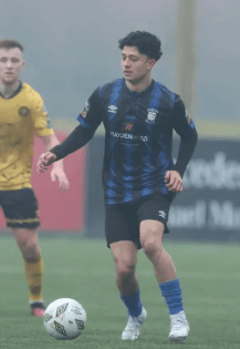 Coach Gabriel Padilla playing in blue and black.