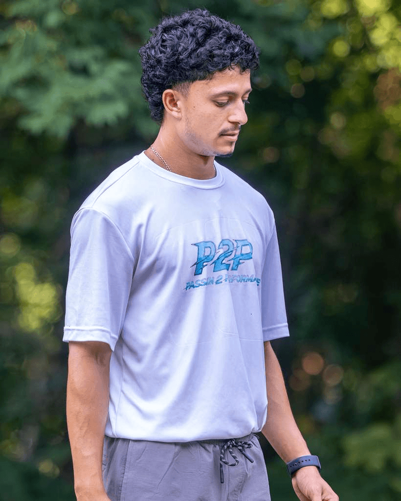 Coach Gabriel Padilla wearing a white P2P training shirt.